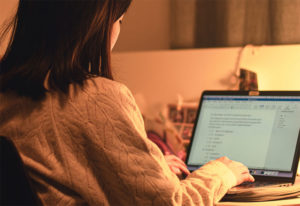 Woman at computer working on online lesson