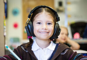 student wearing headphones to make online learning accessible