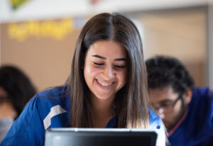 Student engaging with digital learning material Student engaging with digital learning material