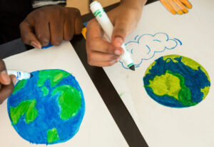 Image of students drawing a picture of the earth