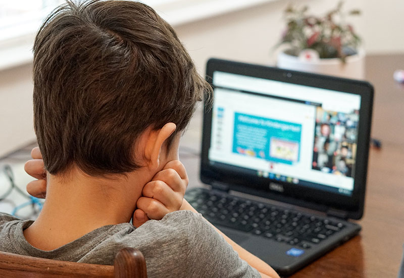 Student participating in virtual distance learning