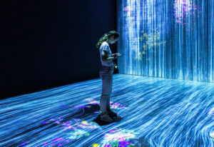 Man standing in front of a wall of LED lights