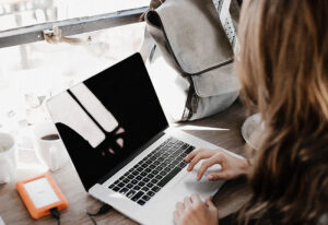 Woman typing on laptop