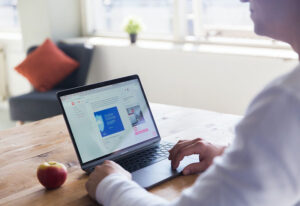 Woman sitting in front of laptop