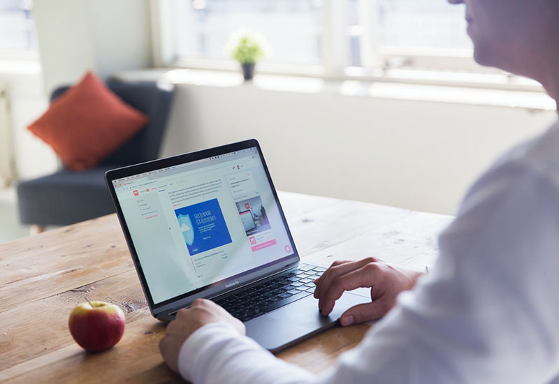 Woman sitting in front of laptop