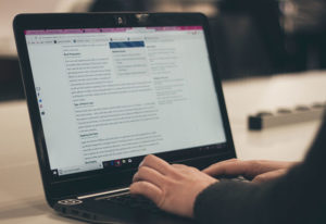 Typing on laptop
