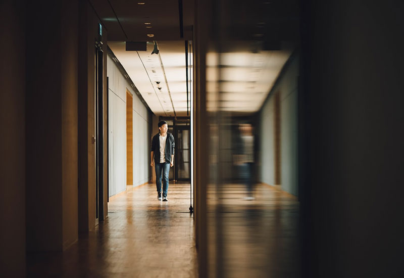 Person walking through hallway at a school